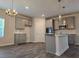 Elegant kitchen with gray cabinets, granite countertops, and stainless steel appliances at 1669 Fuma Leaf Way, Mcdonough, GA 30253