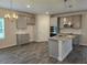 Modern kitchen boasts gray cabinets, granite countertops, and stainless steel appliances at 1669 Fuma Leaf Way, Mcdonough, GA 30253