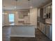 Modern kitchen with stainless steel appliances, gray cabinets, and granite countertops at 1669 Fuma Leaf Way, Mcdonough, GA 30253