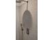Modern shower features tiled walls, a rainfall shower head, and sleek fixtures at 1669 Fuma Leaf Way, Mcdonough, GA 30253