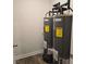 Utility room with two hot water tanks, with energy guide labels at 1669 Fuma Leaf Way, Mcdonough, GA 30253