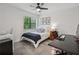 Bright bedroom features a ceiling fan, natural light, and a modern design at 1771 Defoor Nw Ave # D, Atlanta, GA 30318