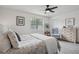 Relaxing bedroom with a ceiling fan, natural light, and a cozy accent chair at 1771 Defoor Nw Ave # D, Atlanta, GA 30318