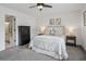 Well-lit bedroom featuring a queen-sized bed, bedside tables, and a convenient en-suite bathroom at 1771 Defoor Nw Ave # D, Atlanta, GA 30318