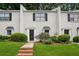 Charming townhouse with brick facade, well-maintained lawn, and black shutters on light colored brick at 1771 Defoor Nw Ave # D, Atlanta, GA 30318