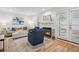 Cozy living area showcasing a fireplace, comfortable seating, and access to a private outdoor space at 1771 Defoor Nw Ave # D, Atlanta, GA 30318