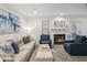 Comfortable living room features a fireplace, neutral sofa, and stylish accents for a relaxed feel at 1771 Defoor Nw Ave # D, Atlanta, GA 30318