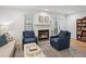 Inviting living room with a cozy fireplace, comfortable seating, and lots of natural light at 1771 Defoor Nw Ave # D, Atlanta, GA 30318