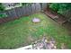 Backyard featuring a fire pit, garden bed, green grass and wood fence at 2668 Jefferson Ter, East Point, GA 30344