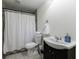 Bathroom featuring a tiled floor, vanity, toilet, and shower with curtain at 2668 Jefferson Ter, East Point, GA 30344