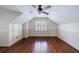 Upstairs bonus room with hardwood floors, wainscoting and white shutters at 2668 Jefferson Ter, East Point, GA 30344