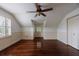Bright bedroom featuring hardwood floors, a ceiling fan, and white trim and walls at 2668 Jefferson Ter, East Point, GA 30344