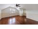 Upstairs bonus room with hardwood floors, wainscoting and white shutters at 2668 Jefferson Ter, East Point, GA 30344