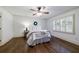 Inviting bedroom with hardwood floors, white walls, and plantation shutters at 2668 Jefferson Ter, East Point, GA 30344
