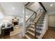 Welcoming foyer with staircase leading to the upper level, adjacent to the living room with fireplace at 2668 Jefferson Ter, East Point, GA 30344