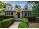 Charming home featuring a stone accented doorway, tidy hedges, and a well-manicured front lawn at 2668 Jefferson Ter, East Point, GA 30344