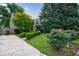 Charming home exterior with well-manicured landscaping, a driveway, and flourishing shrubbery at 2668 Jefferson Ter, East Point, GA 30344