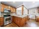 Spacious kitchen with stainless steel appliances, granite counters, and custom cabinetry at 2668 Jefferson Ter, East Point, GA 30344