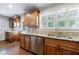 Bright kitchen area featuring granite counters, wood cabinets, and stainless steel appliances at 2668 Jefferson Ter, East Point, GA 30344