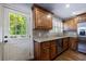 Bright kitchen with stainless steel appliances, granite counters, and access to outdoor deck at 2668 Jefferson Ter, East Point, GA 30344