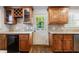 Kitchen area featuring custom wood cabinetry, granite counters, and stainless beverage cooler at 2668 Jefferson Ter, East Point, GA 30344