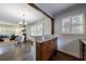 Open-concept living room with dark wood floors, recessed lighting, and elegant chandelier at 2668 Jefferson Ter, East Point, GA 30344