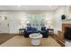 Inviting living room featuring a comfortable sofa, decorative pillows, and natural light from the windows at 2668 Jefferson Ter, East Point, GA 30344