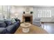 Bright living area with fireplace, shutters, and stylish furnishings on a decorative area rug at 2668 Jefferson Ter, East Point, GA 30344