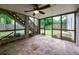 Enclosed sunroom with stone floor offers a transition to the outdoor greenery at 2668 Jefferson Ter, East Point, GA 30344