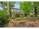 Backyard view featuring a deck and surrounding lush greenery, perfect for outdoor relaxation at 2696 Chancellor Way, Duluth, GA 30096
