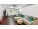 Finished basement living area featuring a large sectional sofa and a mounted television at 2696 Chancellor Way, Duluth, GA 30096