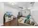 Finished basement living area with a large sectional sofa and a mounted television at 2696 Chancellor Way, Duluth, GA 30096