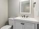 Bathroom featuring a light gray wall, modern toilet, and a granite countertop sink at 2696 Chancellor Way, Duluth, GA 30096
