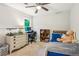 Bedroom featuring neutral paint, a ceiling fan, carpet, and lots of natural light from the exterior window at 2696 Chancellor Way, Duluth, GA 30096