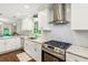 Well-lit kitchen featuring stainless steel appliances and a large granite countertop and backsplash at 2696 Chancellor Way, Duluth, GA 30096