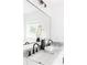Modern bathroom with a gray marble countertop, dual sinks, and black fixtures at 2873 Bob White Sw Dr, Atlanta, GA 30311