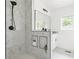 Modern bathroom showcasing a marble shower, black fixtures, and stylish niche shelving at 2873 Bob White Sw Dr, Atlanta, GA 30311