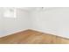 Bright bedroom space with hardwood floors and a window at 2873 Bob White Sw Dr, Atlanta, GA 30311