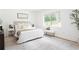 Bright bedroom with a neutral palette, large window, and stylish rug at 2873 Bob White Sw Dr, Atlanta, GA 30311
