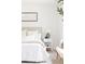 Bright bedroom showcasing neutral decor, cozy bedding, and a modern accent rug at 2873 Bob White Sw Dr, Atlanta, GA 30311