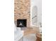 Charming fireplace, next to staircase, with rustic brickwork and cozy seating in a sun-drenched living room at 2873 Bob White Sw Dr, Atlanta, GA 30311