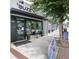 Storefront with glass windows, signage, and outdoor seating, creating an inviting atmosphere at 2873 Bob White Sw Dr, Atlanta, GA 30311