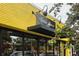 Storefront with glass windows, signage, and dark trim on a yellow brick building at 2873 Bob White Sw Dr, Atlanta, GA 30311