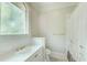 Bathroom featuring a white vanity, toilet, and shower with patterned curtain at 42 Greenland Trce, Atlanta, GA 30342