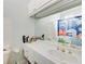 Bathroom featuring a single sink vanity and mirror with decorative dinosaur shower curtain at 42 Greenland Trce, Atlanta, GA 30342