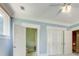 Bedroom with ceiling fan, double closets and view of adjacent bathroom at 42 Greenland Trce, Atlanta, GA 30342