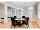 Dining room featuring a round table with upholstered chairs, hardwood floors, and bright windows at 42 Greenland Trce, Atlanta, GA 30342