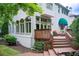 Exterior view of a home showcasing a deck, multiple arch windows, and brick exterior at 42 Greenland Trce, Atlanta, GA 30342