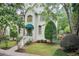 Charming home featuring lush landscaping, a neatly maintained lawn, and an inviting entrance at 42 Greenland Trce, Atlanta, GA 30342