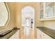 Hallway with built-in cabinets and counters, leading to a bright room with outside access at 42 Greenland Trce, Atlanta, GA 30342